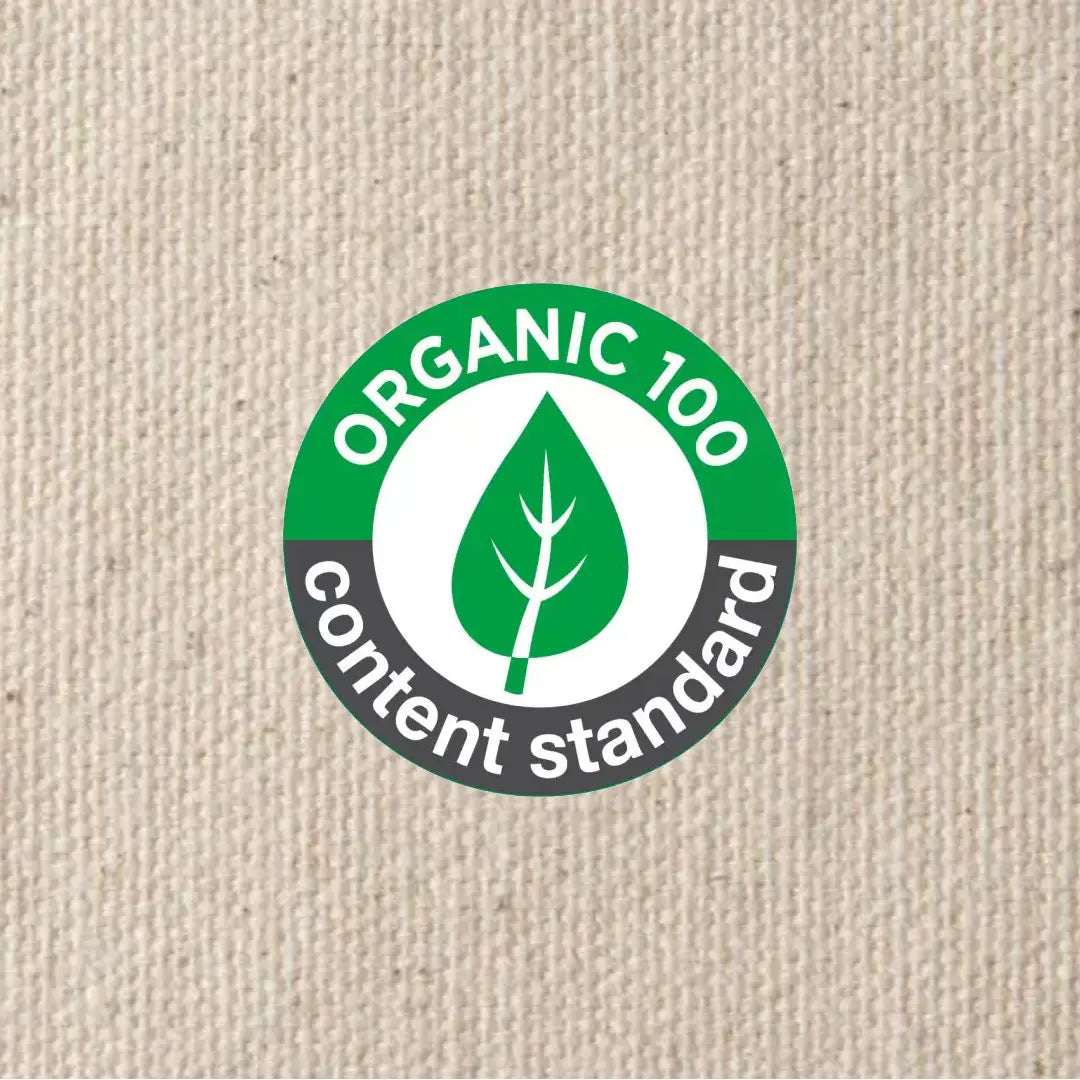 Organic content standard label on a beige fabric background